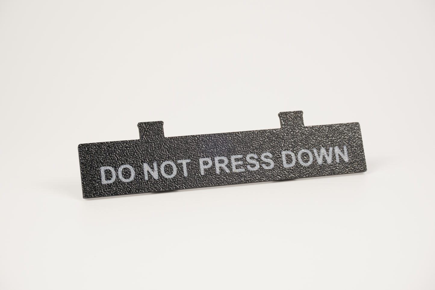 Do Not Press Down black Ninten-Drawer faceplate